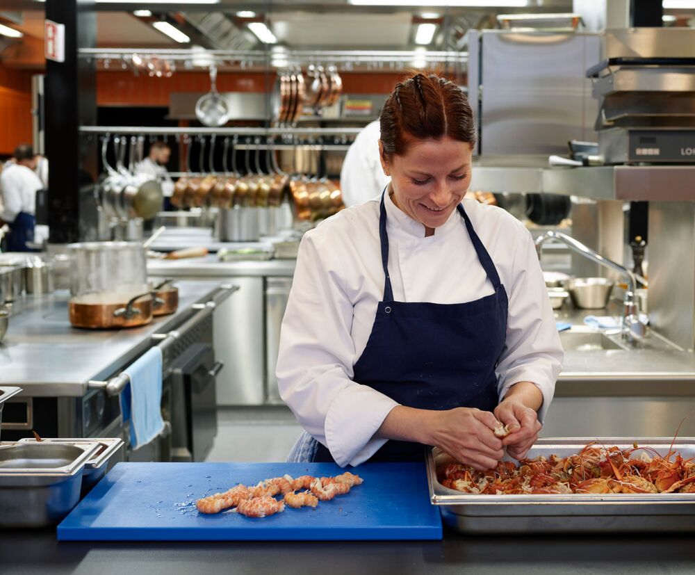 Virginie Protat, Executive Chef of „Tantris DNA,“ is in her element in the Tantris kitchen.